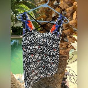 Unique and vibrant pattern top.